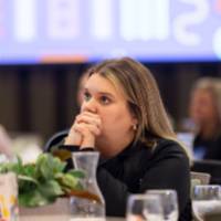 person at table listening